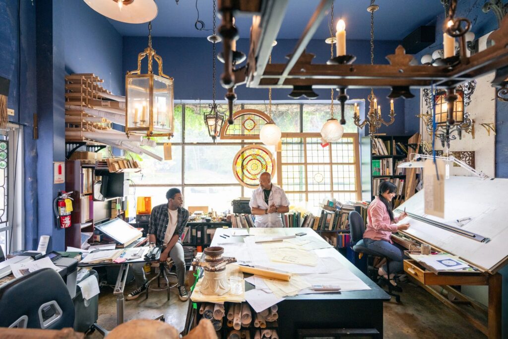 Wide shot of a Team of architects working in the studio on a home renovation project