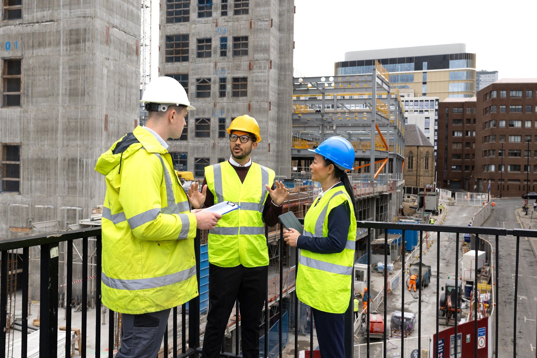 Construction professionals reviewing plans together on site